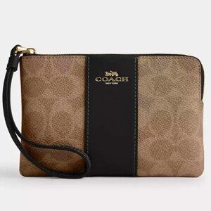 Coach corner zip wristlet in signature canvas with stripe